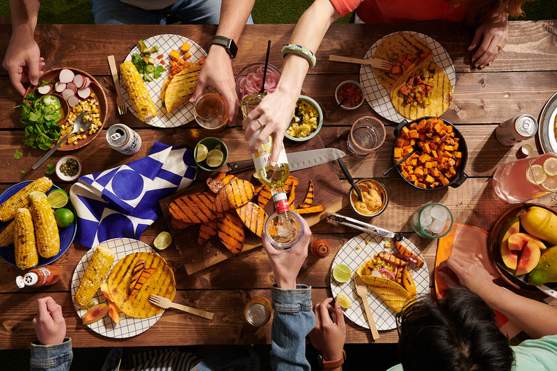 An assortment of meals using the seed oil free products from Roots Farm Fresh on a table.