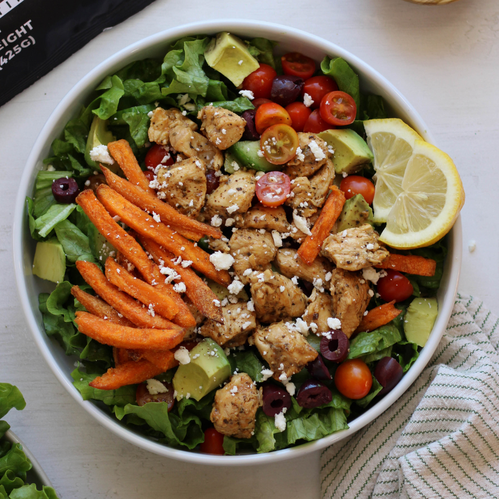High Protein Greek Chicken Salad with Organic Sweet Potato Fries, Lemon Chicken, and Creamy Feta Pesto