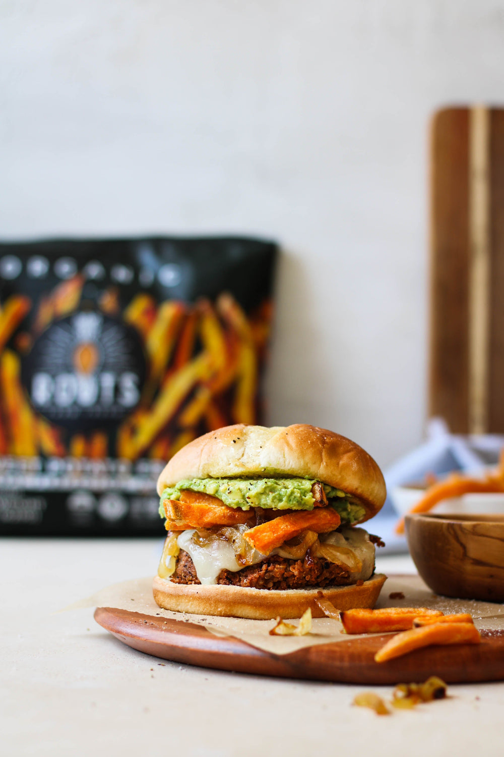 Vegetarian Quinoa Black Bean Burgers with Organic Sweet Potato Fries, Avocado, and Caramelized Onions